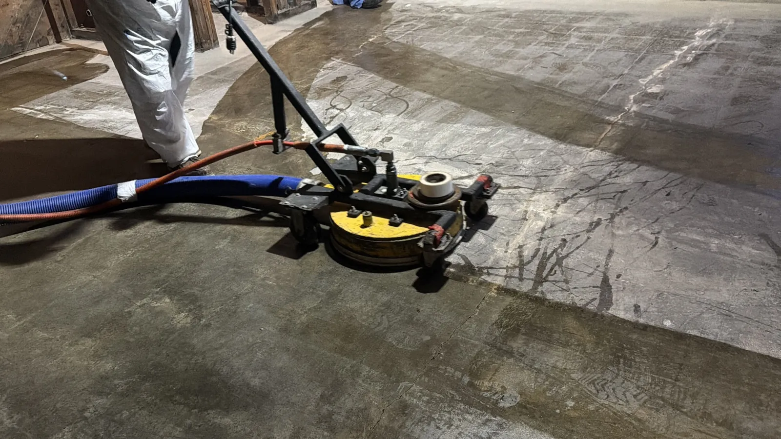 UHP water blasting head working across a concrete slab during surface preparation